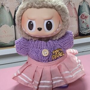 An Adorable Purple & Pink Outfit. Includes Sweater,skirt,&shoes. Doll Not Includ